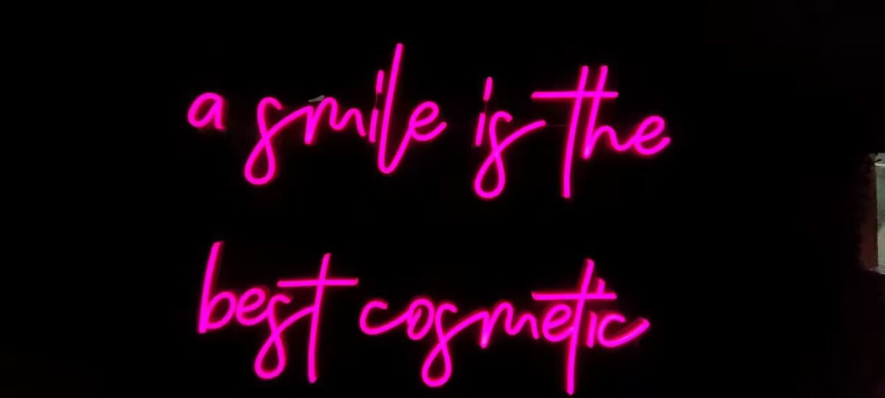 A smile is the best cosmetic Neon Sign