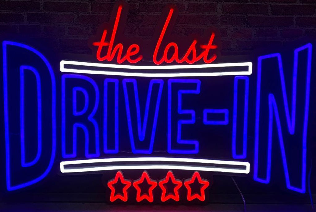 the last drive in neon sign