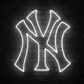 A glowing white neon-style New York Yankees 'NY' logo neon sign.