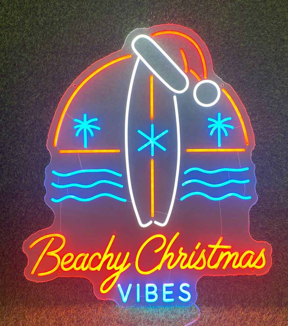 Surfboard with santa hat neon sign