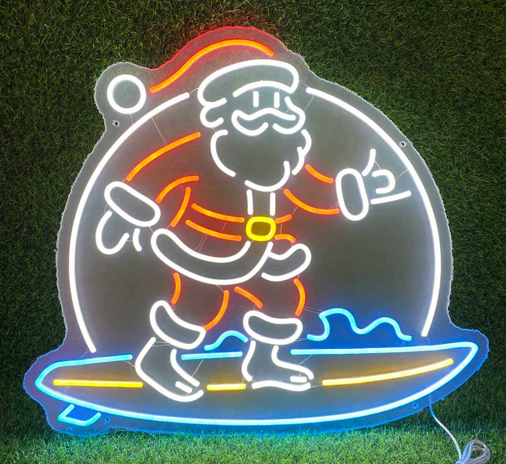 santa on a surfboard neon sign