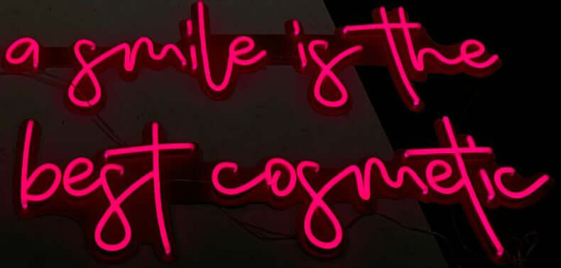 a smile is the best cosmetic neon sign