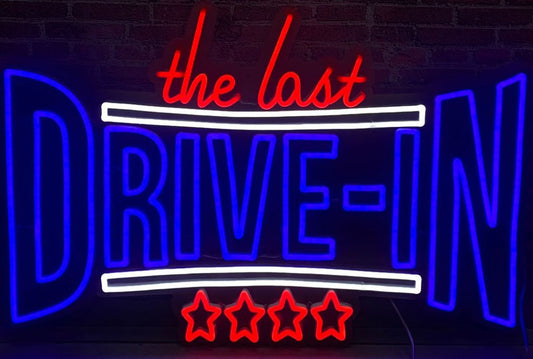 the last drive in neon sign